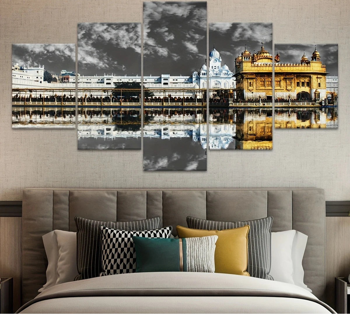 Five-panel wall art of a golden temple with a bed and pillows in the foreground.