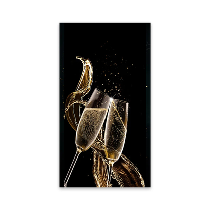 A vertical rectangular wall art print featuring two champagne flutes clinking against a black background with a dramatic gold champagne splash and bubbles. The print is shown centered on a plain white background.
