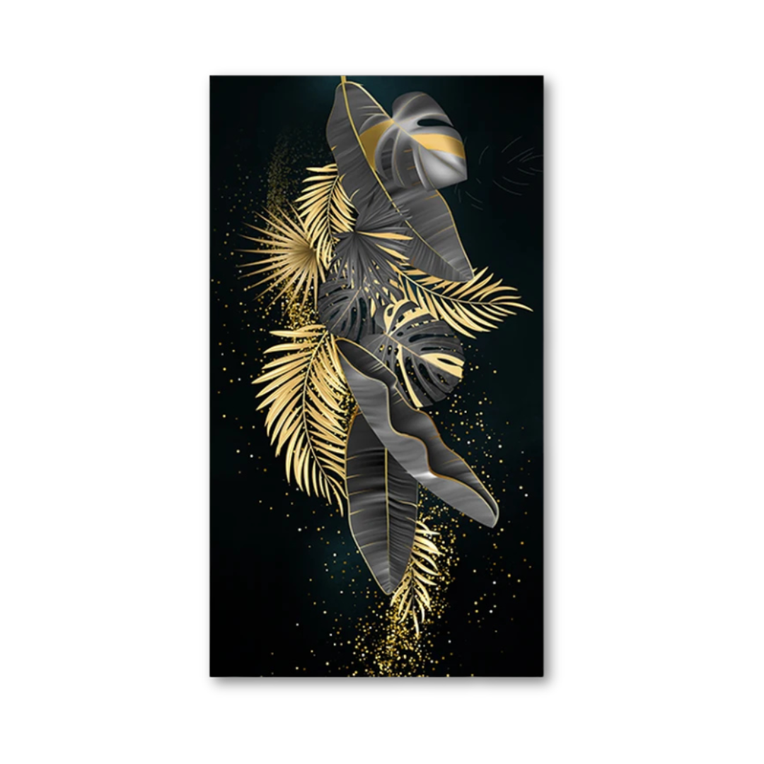 A vertical rectangular wall art print featuring stylized tropical leaves in metallic gold and dark gray on a black background, shown against a plain white wall.