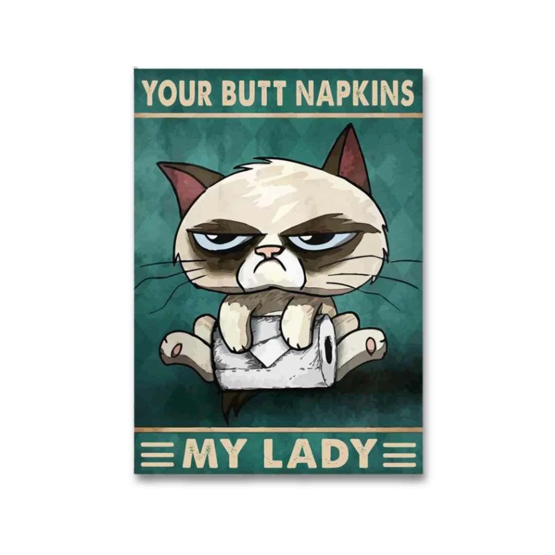 A rectangular novelty sign or poster featuring a cartoon grumpy cat sitting on a roll of toilet paper, with the text 'YOUR BUTT NAPKINS' at the top and 'MY LADY' at the bottom, shown against a plain white background.