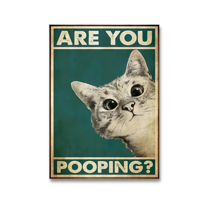 A framed humorous poster featuring a close-up illustration of a cat's face on a dark teal background with the text 'ARE YOU POOPING?' in cream lettering.