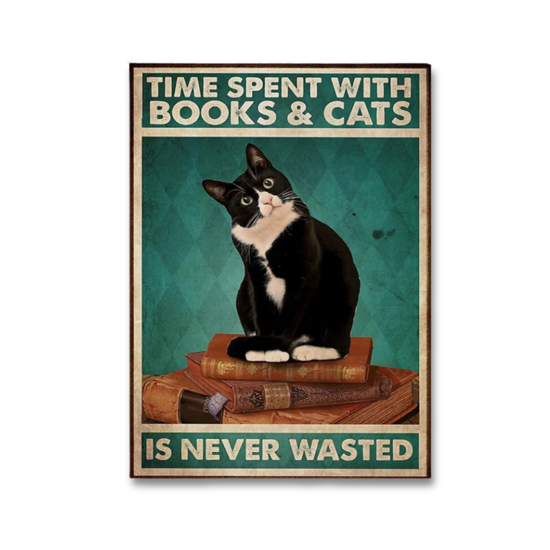 A vintage-style poster featuring a black-and-white cat sitting on stacked books against a teal background, with the text 'TIME SPENT WITH BOOKS & CATS IS NEVER WASTED' in cream lettering.