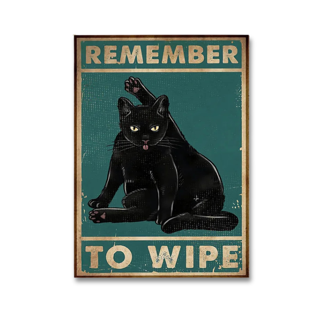 A rectangular vintage-style poster featuring a black cat licking its lips against a teal background, with the text 'REMEMBER TO WIPE' in distressed cream lettering. The poster is shown centered on a light gray background.