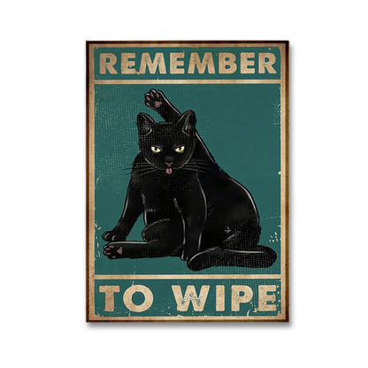 A rectangular vintage-style poster featuring a black cat licking its lips against a teal background, with the text 'REMEMBER TO WIPE' in distressed cream lettering. The poster is shown centered on a light gray background.
