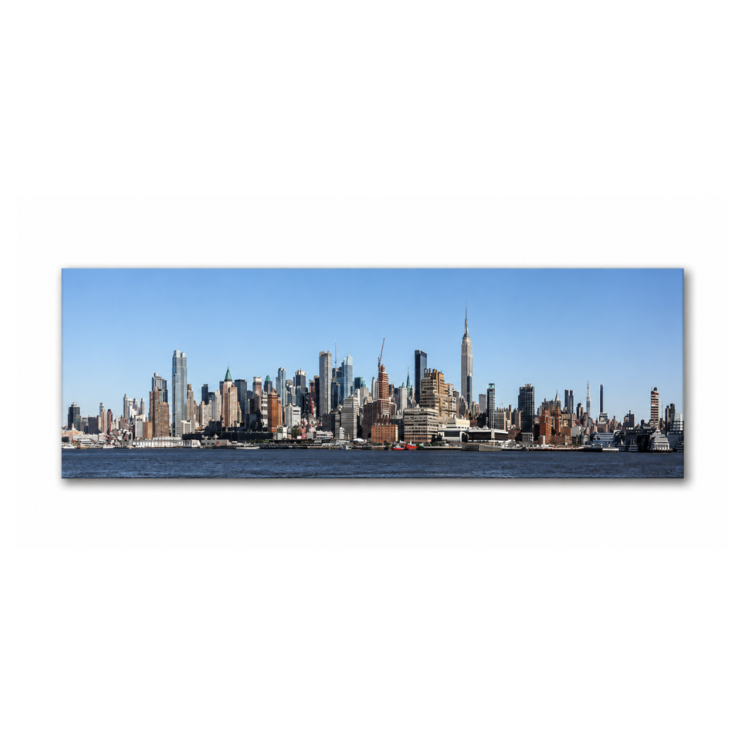 Panoramic canvas wall art depicting the New York City skyline across the water under a clear blue sky, shown as a rectangular print on a white background.