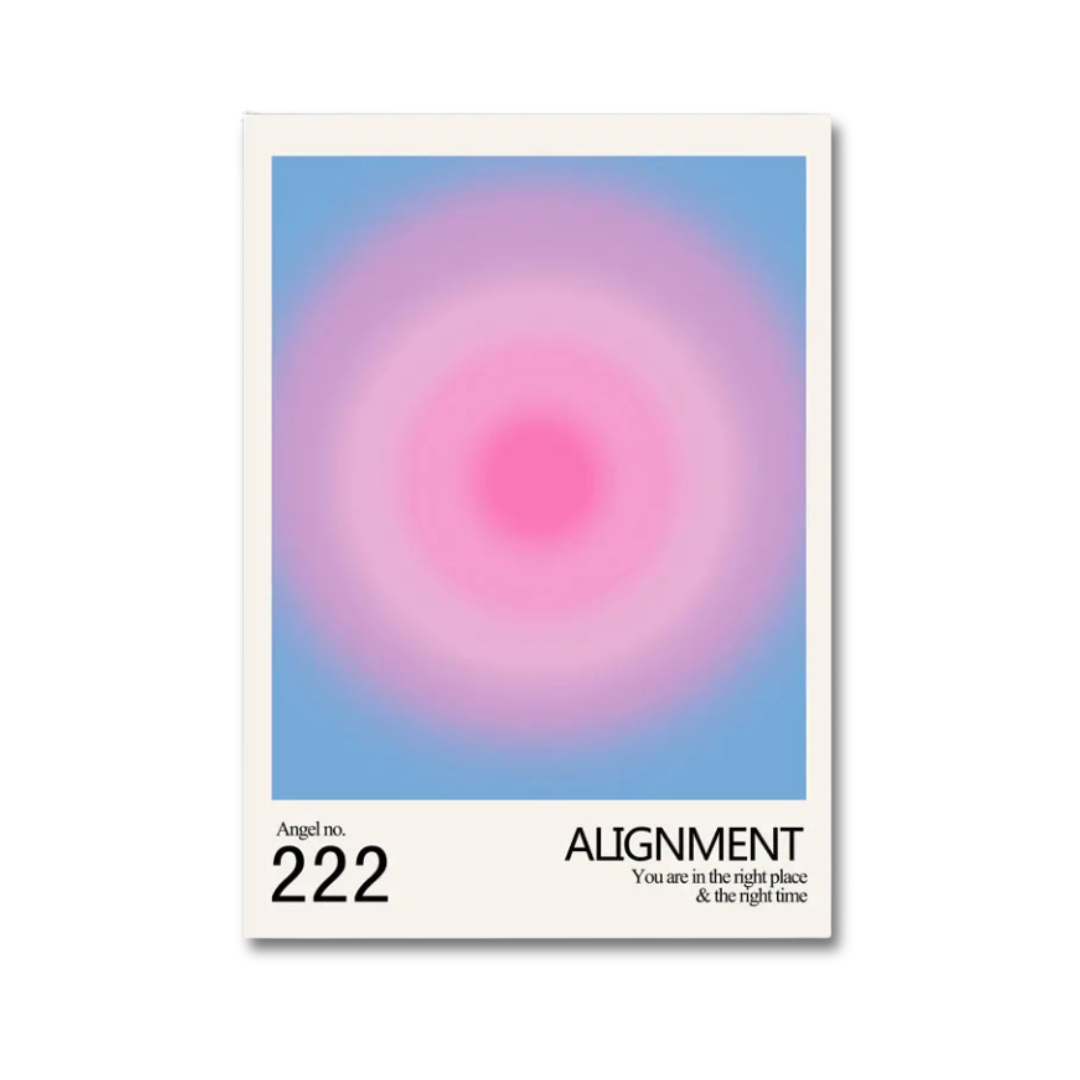 A minimalist art print or poster featuring a soft pink and purple circular gradient on a light blue background, framed by a white border with the text 'Angel no. 222 ALIGNMENT You are in the right place & the right time' at the bottom.