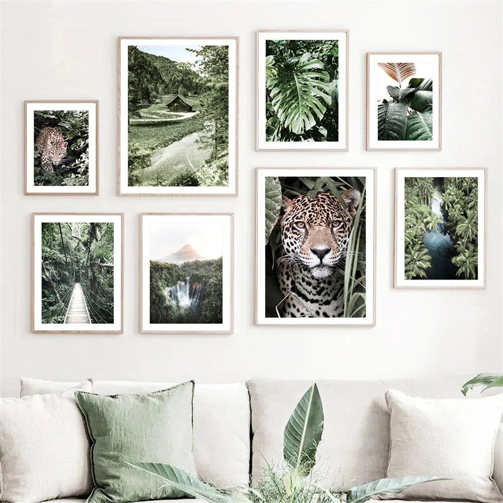 leopard in tropical jungle with palm and monstera leaves on canvas
