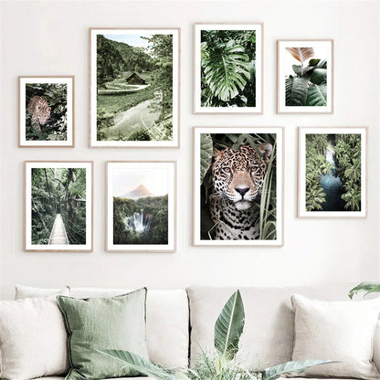 leopard in tropical jungle with palm and monstera leaves on canvas