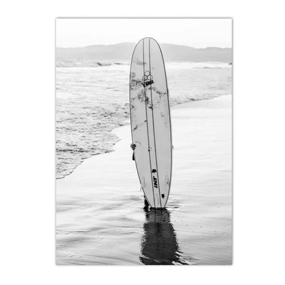 black and white beach scene girl holding surfboard canvas
