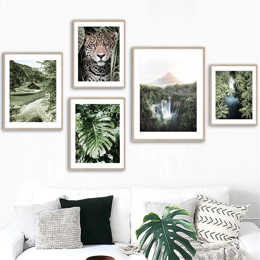 leopard in tropical jungle with palm and monstera leaves on canvas