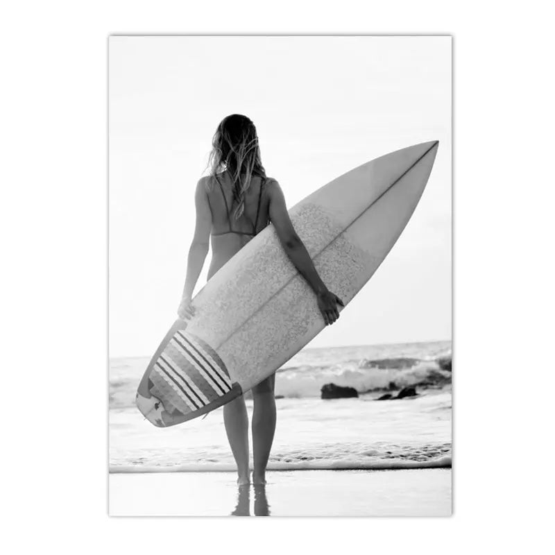 black and white beach scene girl holding surfboard canvas