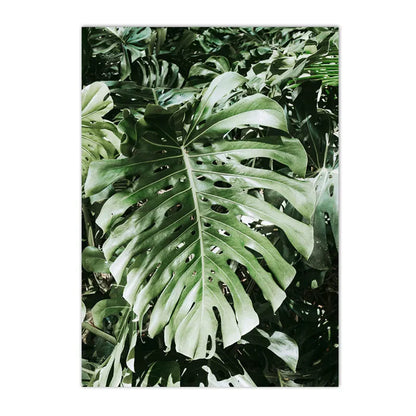 leopard in tropical jungle with palm and monstera leaves on canvas
