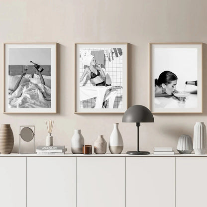 black and white fashion woman holding drink canvas wall art