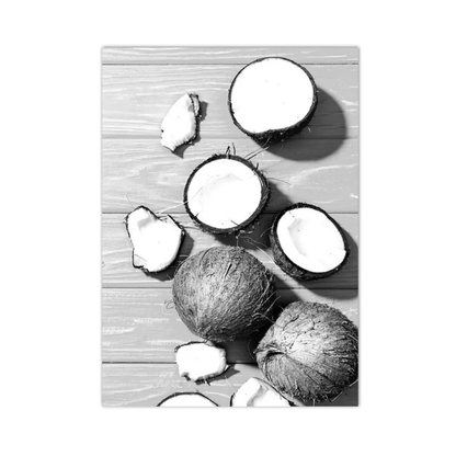 A black and white photographic art print depicting various coconuts, including whole coconuts, halves, and pieces, arranged on a light wood plank surface.