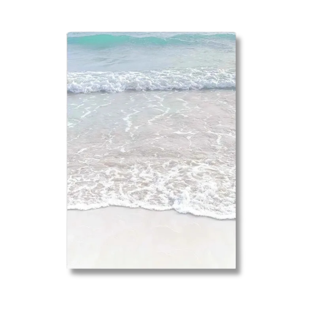 A vertical canvas wall art print depicting a serene beach scene with turquoise ocean waves washing onto pale sand, shown against a plain white background.