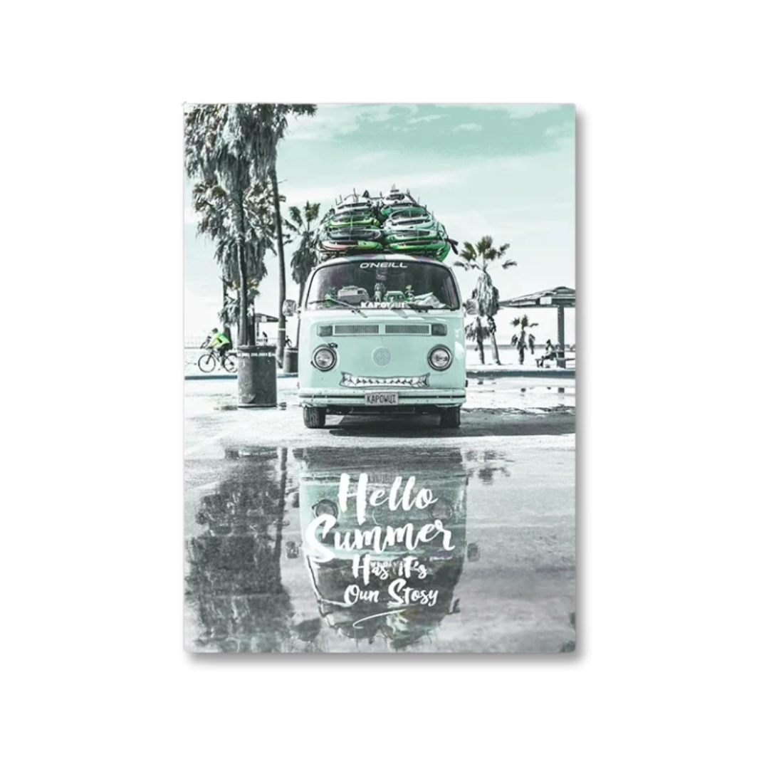A vertical rectangular wall art print showing a retro light blue Volkswagen camper van parked by a beach with surfboards on top, palm trees, and a wet pavement reflection. White script text at the bottom reads, 'Hello Summer How's Our Stoozy.