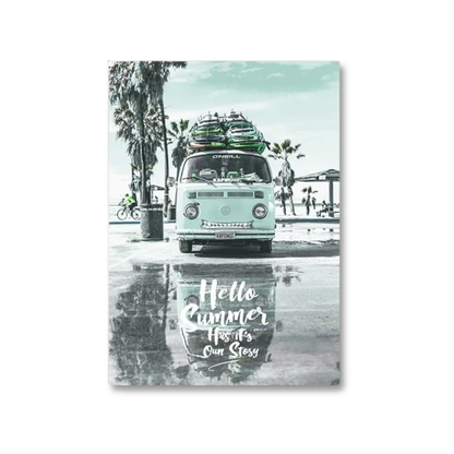 A vertical rectangular wall art print showing a retro light blue Volkswagen camper van parked by a beach with surfboards on top, palm trees, and a wet pavement reflection. White script text at the bottom reads, 'Hello Summer How's Our Stoozy.